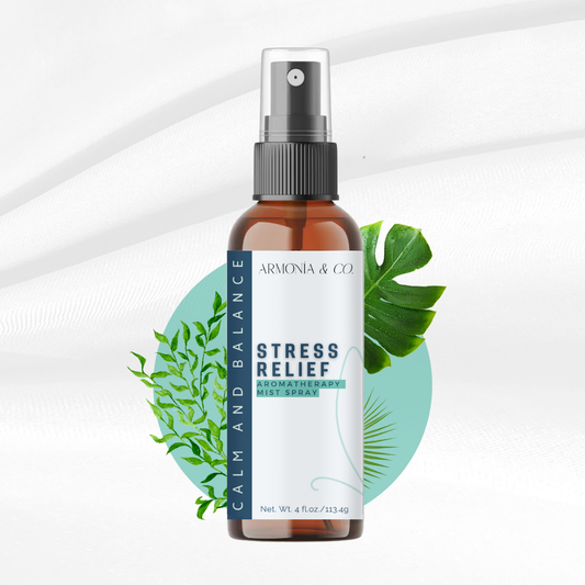 Bottle of 'Stress Relief' spray with green leaves on a white background